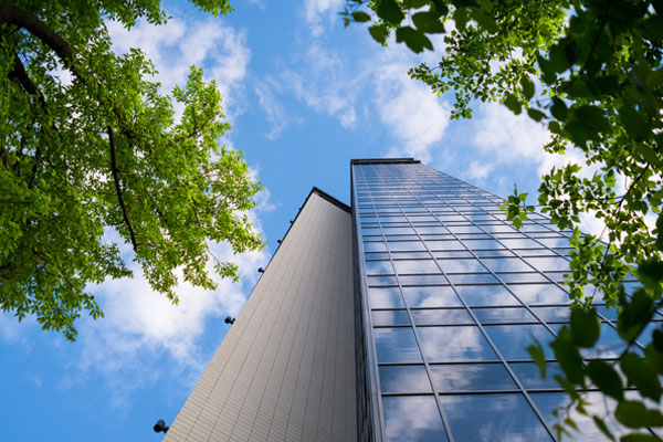 Top 3 Underrated Commercial Property Management Services feature blog image with tall commercial building